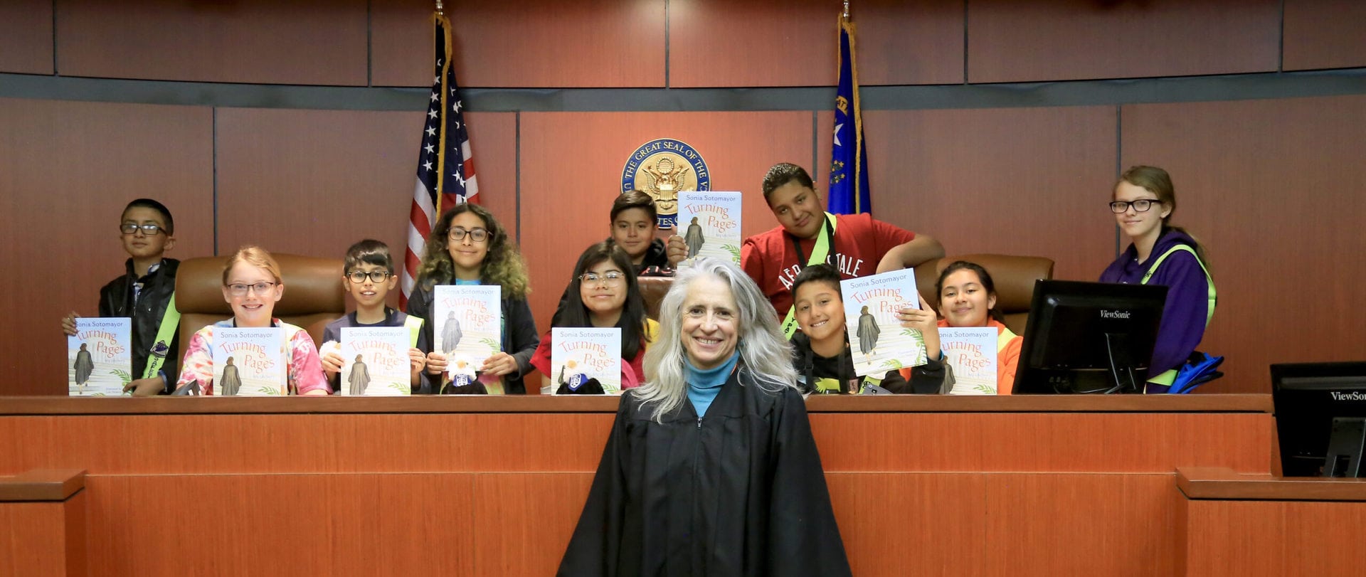 KIds holding up books & Judge Sotomeyer