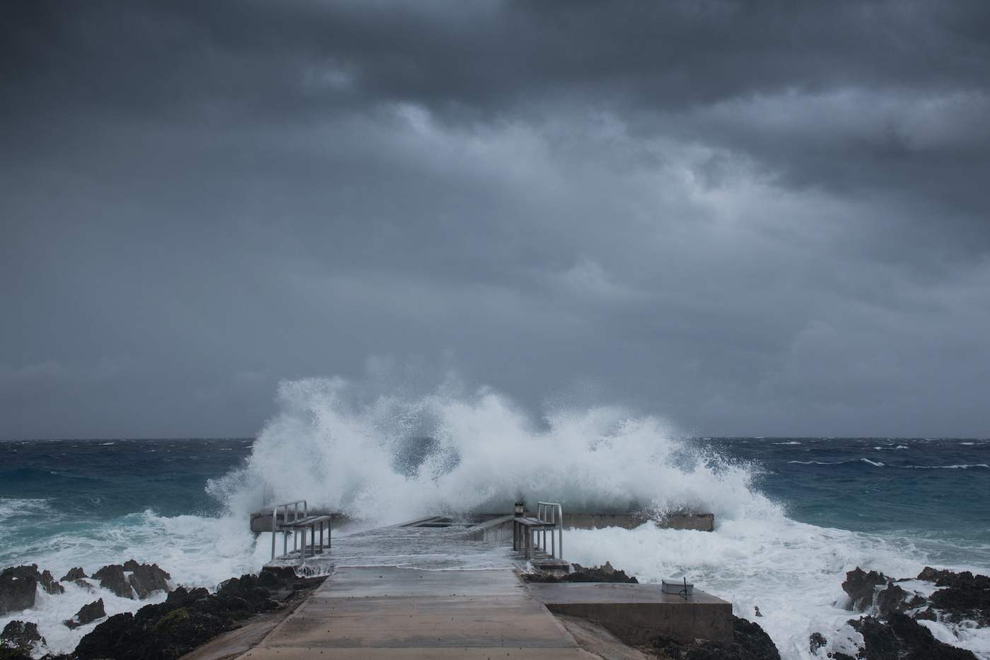 A dock getting pounded by Hurricane Laura as she lands on Grand Cayman