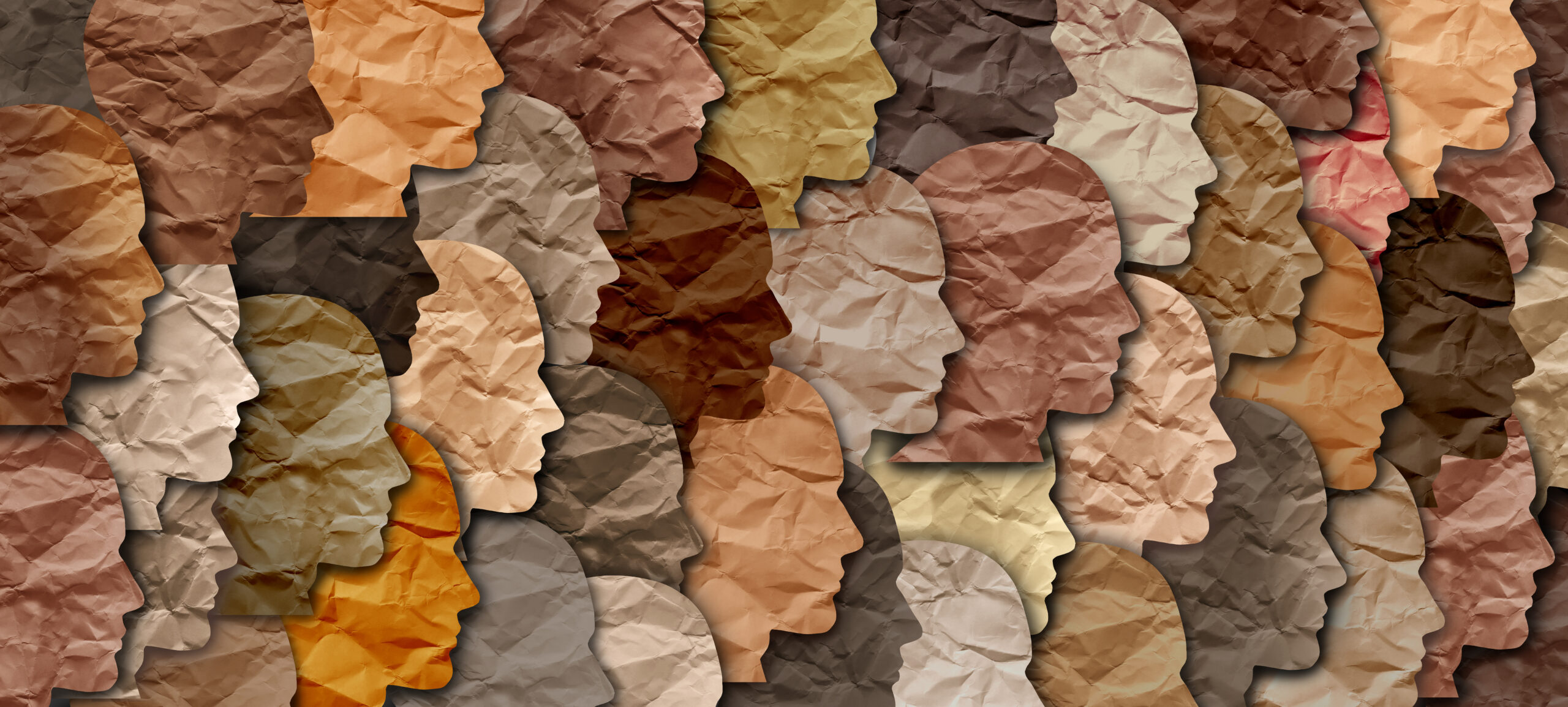 Various colors of paper heads, all slightly crinkled