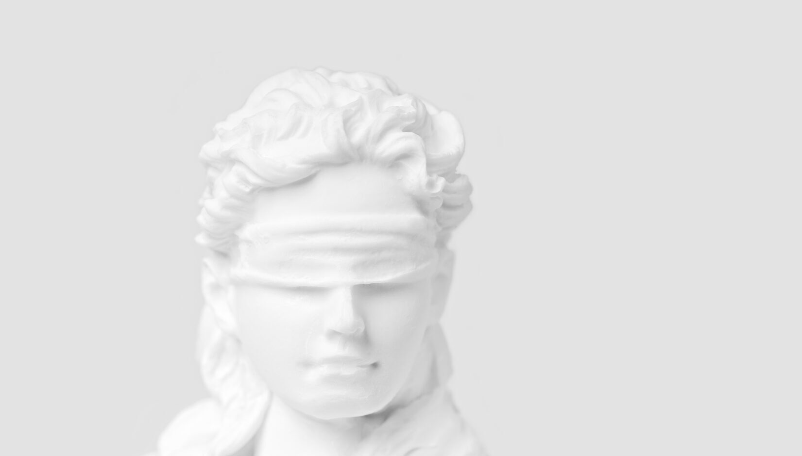 Photo of white marble lady justice bust with blindfold