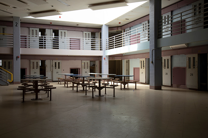 Abandoned jail common room in cell block