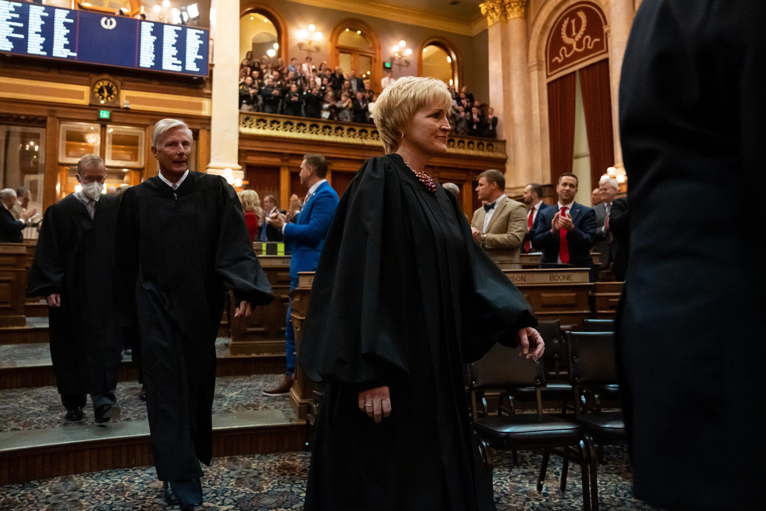 Iowa's Supreme Court Justices, lead by Chief Justice Susan Christensen, enter the Iowa House chamber